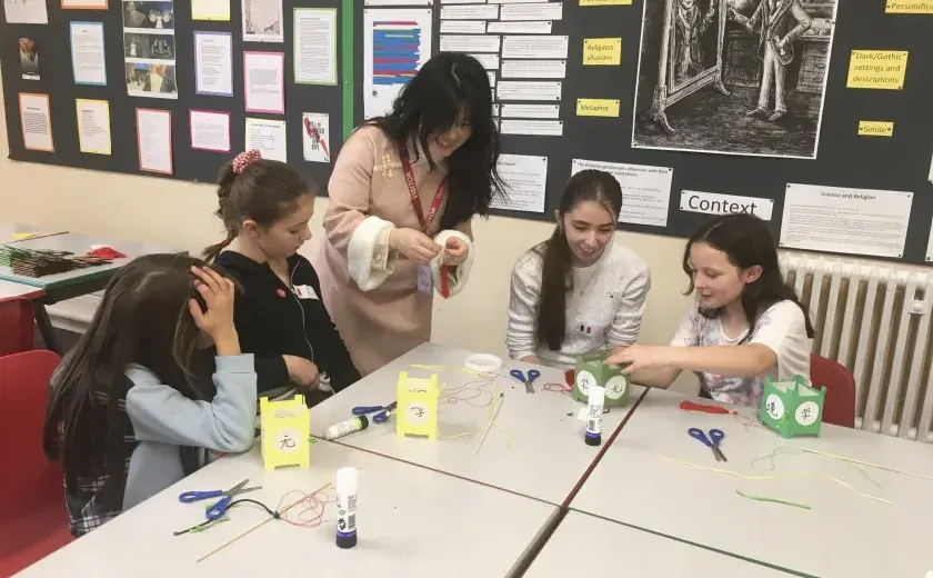 Year 5 and 6 pupils creating Chinese lanterns