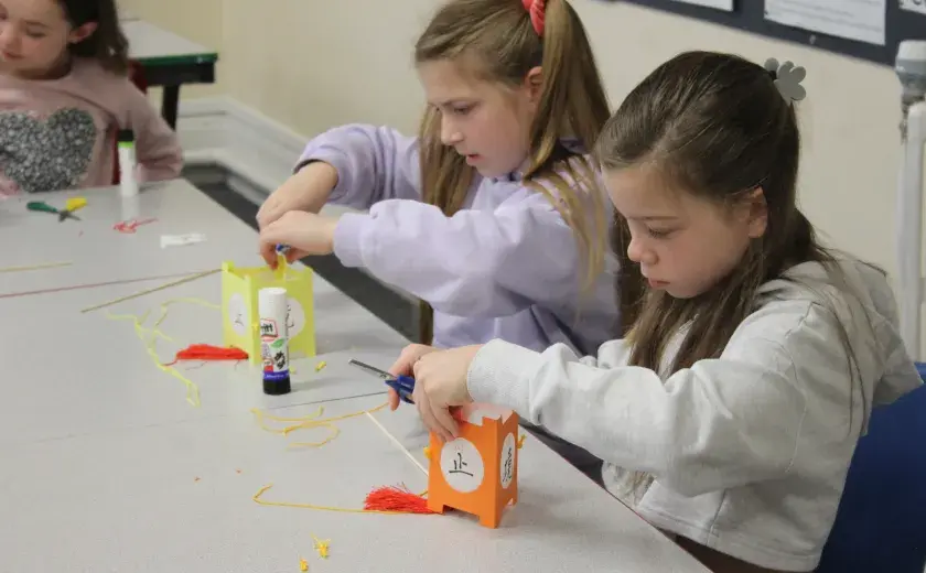 Year 5 and 6 pupils creating Chinese lanterns