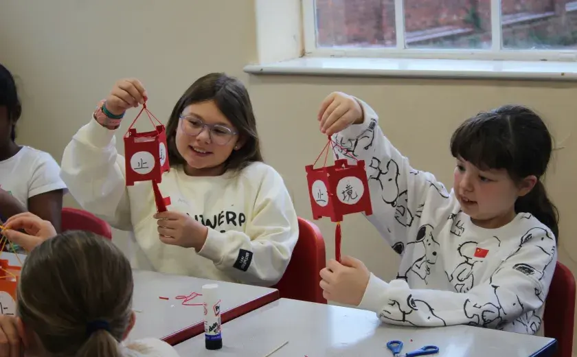 Year 5 and 6 pupils creating Chinese lanterns