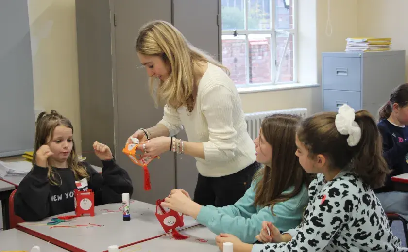 Year 5 and 6 pupils creating Chinese lanterns