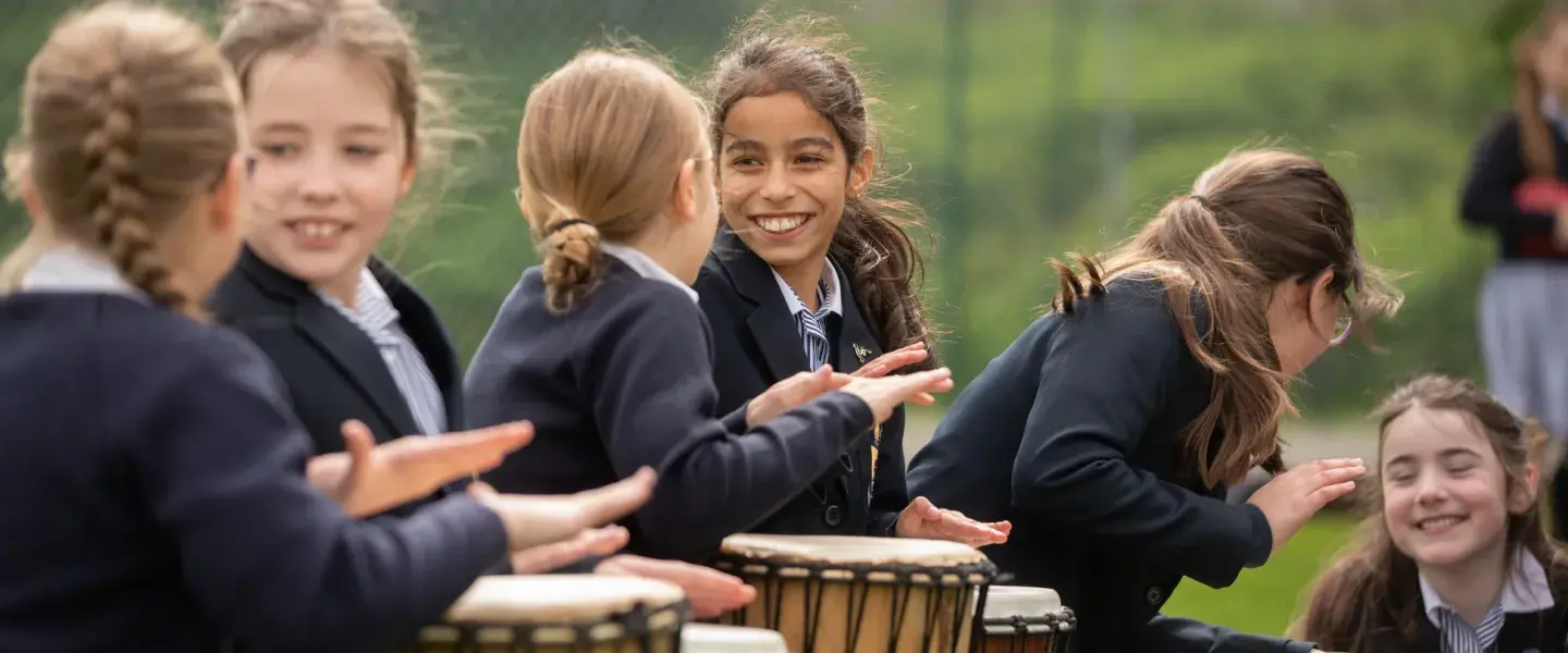 Girls playing the drums